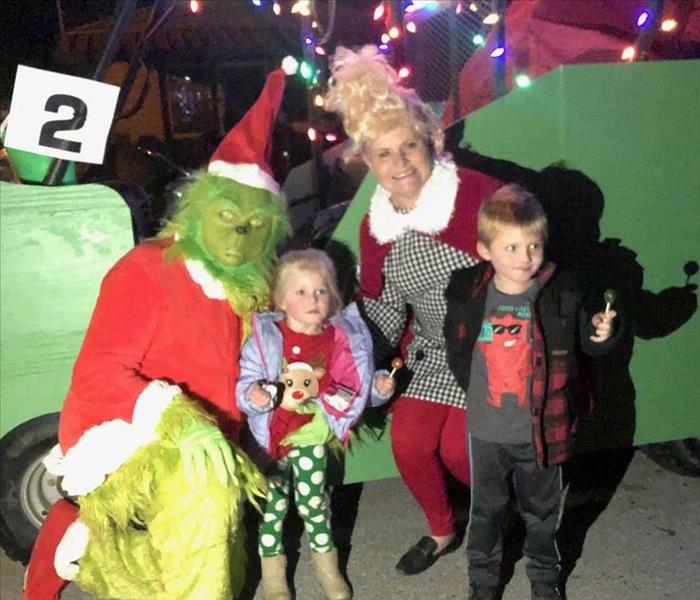 Grinch, Cindy Lou Who, and two kids